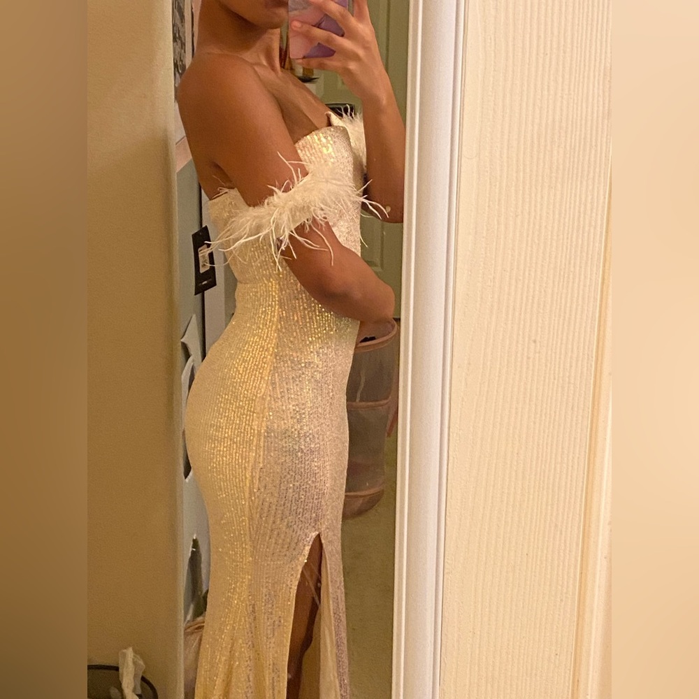This is an off white strapless sequin dress.